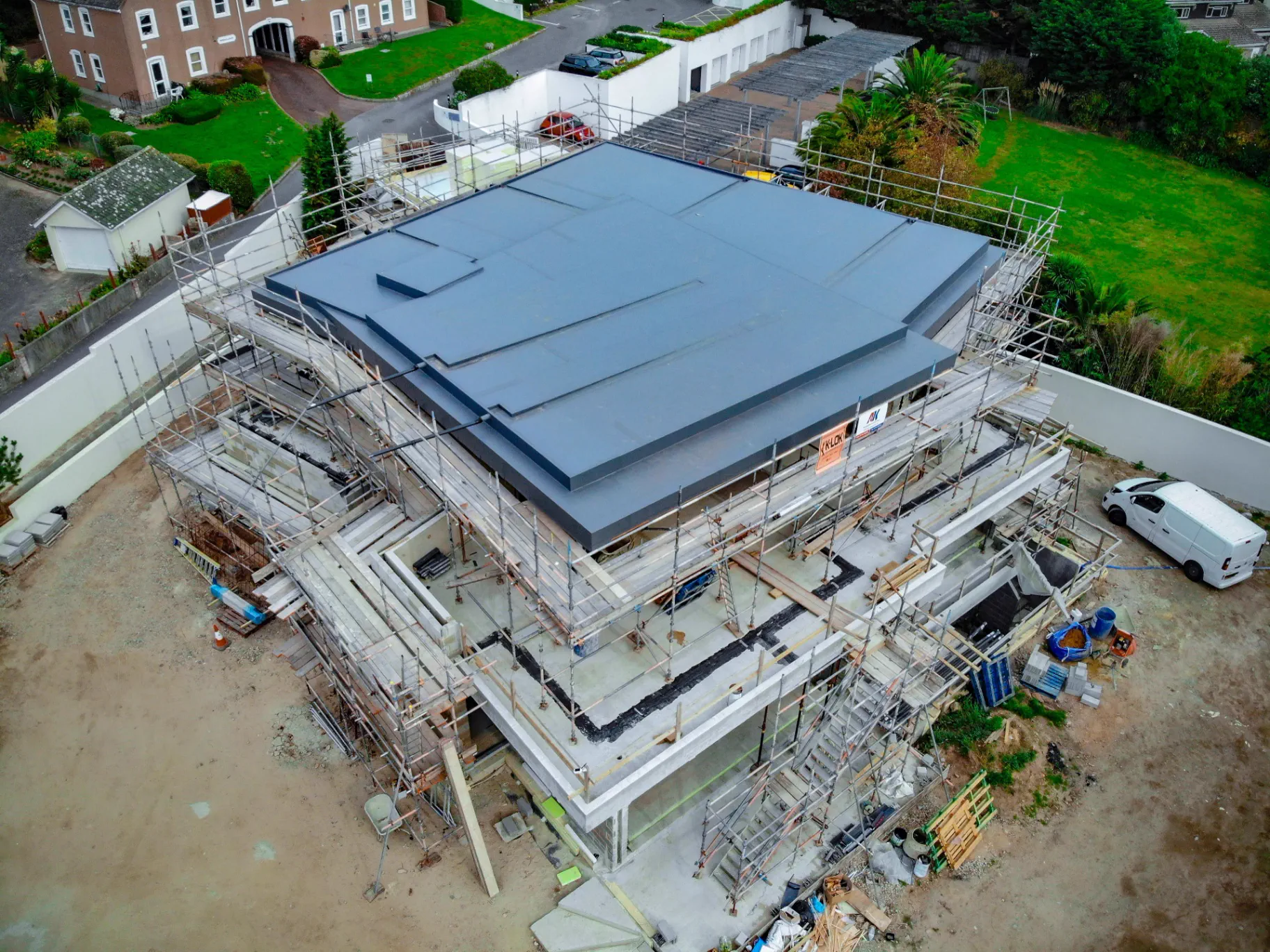 Aerial view of a completed flat roof by Amber Roofs in Jersey