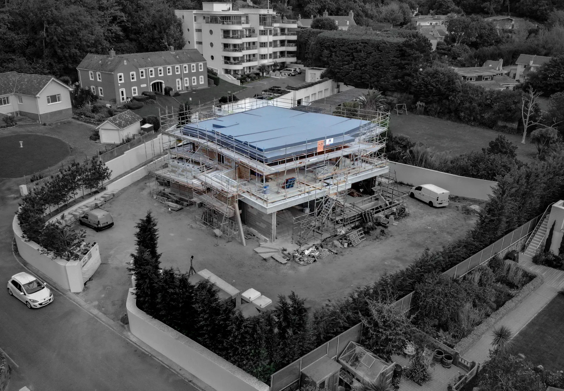 Flat roof project in progress with scaffolding in Jersey