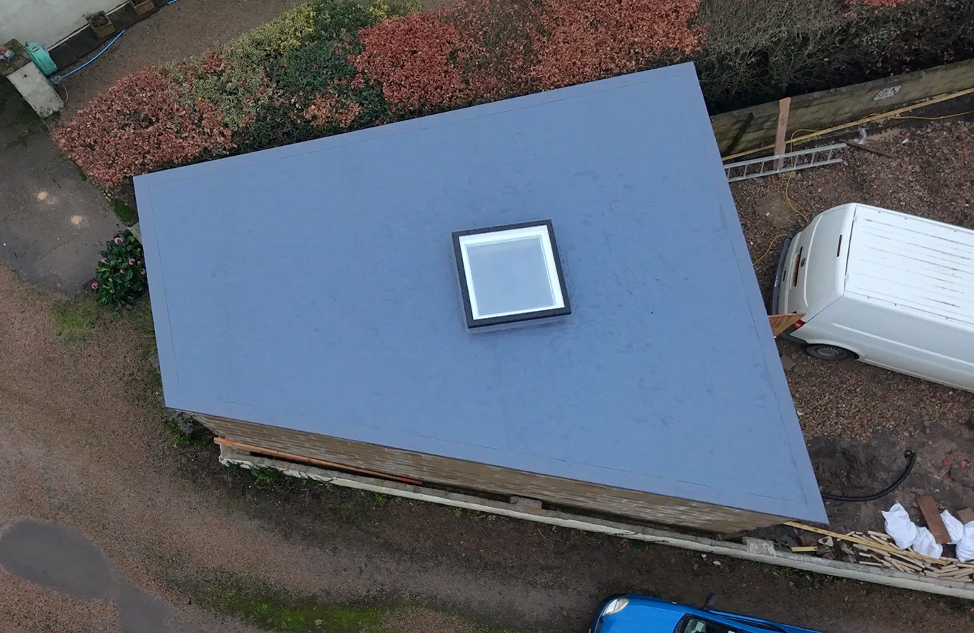 Membrane Install On Site - completed single-ply membrane flat roof by Amber Roofs in Jersey